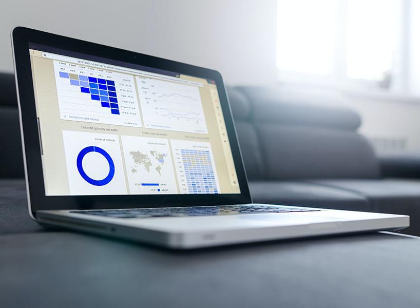 laptop displaying charts and graphs