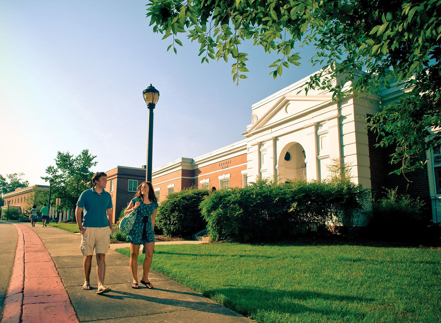 students walking in front of Sanford Hall