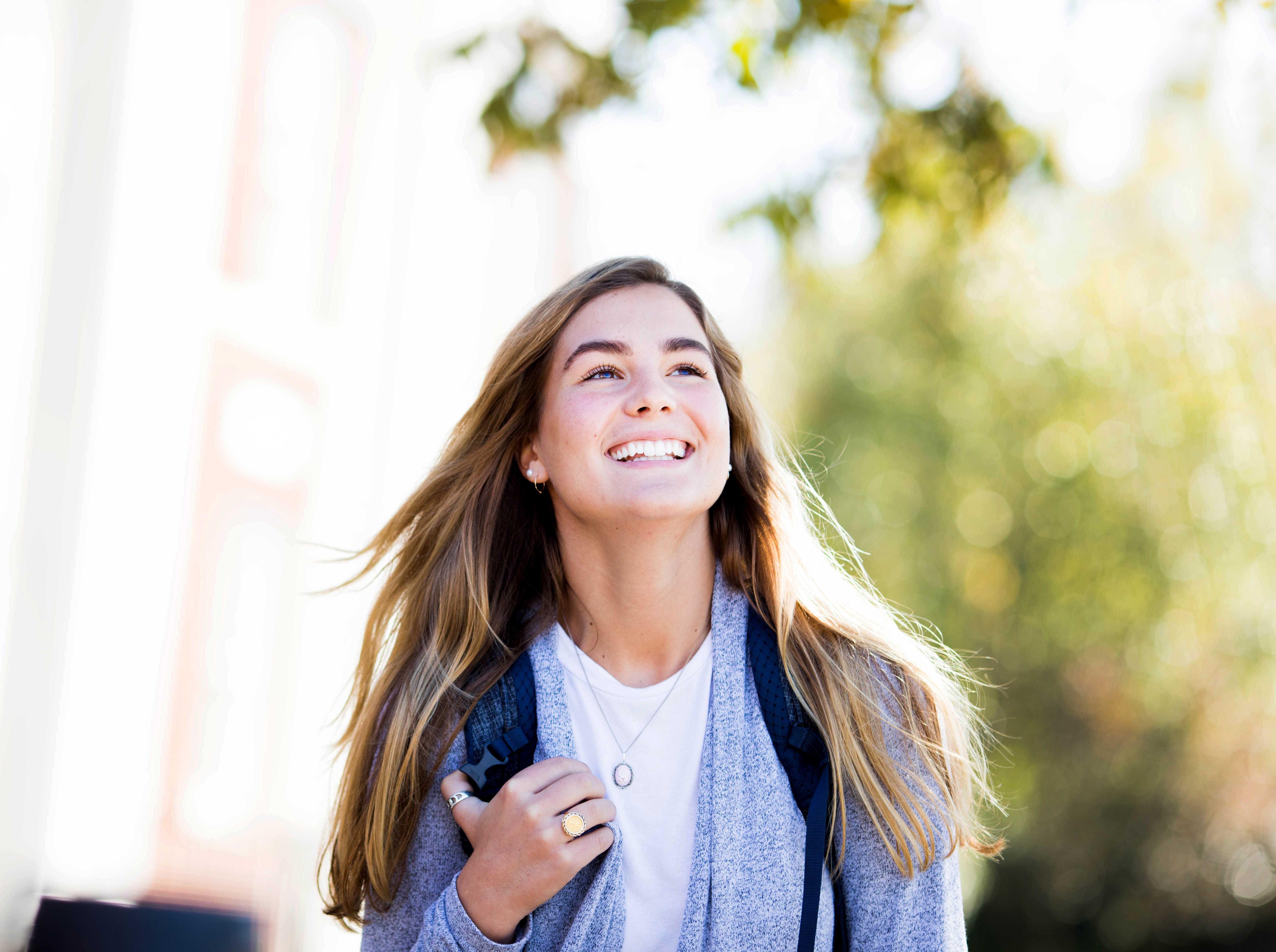 A female student walking outside